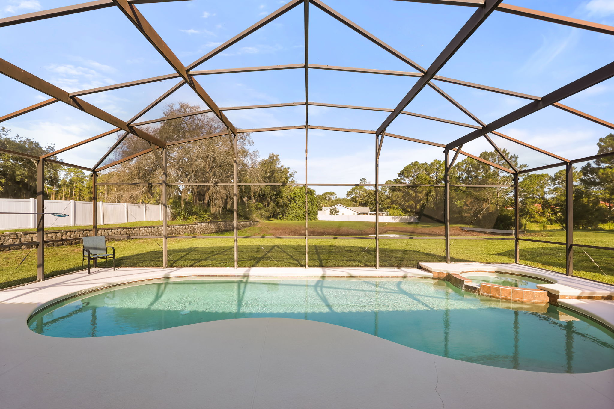 Private screened pool and heated spa overlooking open conservation space